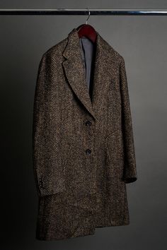 A handmade bespoke topcoat with a perfect balance of warmth, durability, and softness. The substantial weight provides exceptional insulation, making it ideal for colder weather. The classic herringbone pattern adds a touch of sophistication and the texture is unmatched. Business Wool Coat With Herringbone Pattern For Fall, Fall Business Wool Coat With Herringbone Pattern, Business Herringbone Wool Coat For Fall, Fall Herringbone Wool Coat For Business, Classic Tweed Outerwear With Hidden Button Closure, Classic Outerwear With Herringbone Pattern And Lapel Collar, Classic Wool Coat With Herringbone Pattern For Fall, Classic Herringbone Outerwear With Lapel Collar, Black Herringbone Outerwear For Business