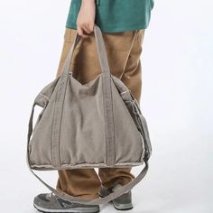 45354201874653 School Satchel In Khaki With Large Capacity, Large Capacity Khaki Satchel For School, Trendy Large Capacity Shoulder Weekender Bag, Casual Large Capacity Bags For Everyday Use, Large Capacity Duffle Bag Satchel For Daily Use, Large Capacity Shoulder Duffle Bag For Everyday Use, Large Capacity Duffle Bag For Daily Use, High-capacity Shoulder Bag For School, Trendy Canvas Shoulder Weekender Bag