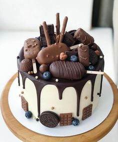 a chocolate covered cake sitting on top of a wooden table