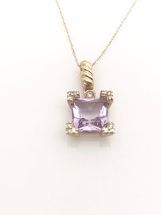 Delight her with this exquisite 14k gold amethyst necklace. This unique February birthstone dainty necklace has brilliant diamond accents set in the prongs, it creates a sparkling outline around the gemstone. Bright and vivid, the scissor cut of the 7.0mm princess cut amethyst at the heart of this pendant is striking. Sure to become her favorite, this eye catching one of a kind gemstone pendant is a perfect gift for the jewelry loving woman! This exceptional pendant suspends from an 18.0-inch ro Fine Jewelry Purple Diamond Necklace, Purple Diamond Necklace Fine Jewelry, Elegant Purple Necklace With Prong Setting, Purple Diamond Necklace In Fine Jewelry Style, Purple Diamond Necklace With Diamond Accents, Lavender Fine Jewelry With Diamond Accents, Purple Diamond Birthstone Necklace, Lavender Amethyst Jewelry With Diamond Accents, Lavender 14k Gold Jewelry For Formal Occasions