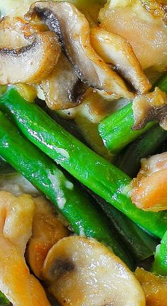 chicken and asparagus stir fry with sauce on top