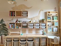 a child's room with toys and bookshelves