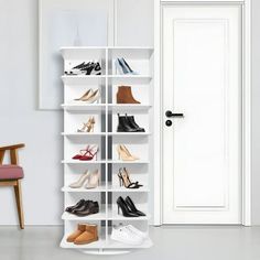 a white shoe rack sitting next to a door