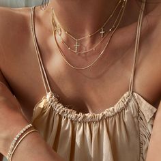 Perfect for both day and night, this necklace is sure to turn heads. Henio's rounded snake chain design, simple and femimine in style, will add shine as a statement on its own or be layered for endless glimmer. Check out the matching Taysom bracelet and Tejano anklet. Created with a sterling silver base and utilizing luxurious 14 karat gold plating, this Adorn Luxe necklace is everything you love about our demi-fine jewelry collection. Layering Snake Chain Necklace, Double Chain Snake Necklace For Layering, Snake Chain Necklace With Double Chain For Layering, Gold Snake Chain Layered Necklace, Chic Snake Chain Layered Necklace, Gold Clavicle Chain Charm Necklace With Snake Chain, Chic Layered Snake Chain Necklace, Clavicle Charm Necklace With Snake Chain, Party Jewelry: Clavicle Snake Chain