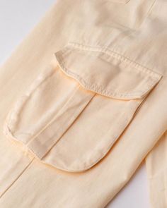 Details: Beige long cargo pants with pockets and ankle drawstring designBottom Length: LongMaterials:95% Polyester + 5% Spandex