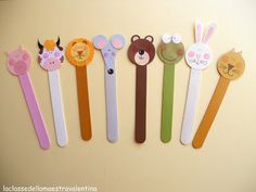 several different colored toothbrushes with animals on them