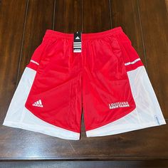 Brand New With Tags, Rare, 2012, Adidas “Louisiana Ragin Cajuns” Red/White “Mvp” Climalite Performance Basketball Shorts In Size Mens Large. As Always 100% Authentic Adidas Goods From A Trusted Poshmark Ambassador. 100% Performance Polyester. These Shorts Do Have The Front 2 Pockets. Very Rare And Hard To Find Shorts. Retail: $45.00 Thank You For Visiting My Closet!! Red Three Stripes Activewear For Sports, Adidas Red Athletic Shorts For Sports, Adidas Red Training Bottoms, Red Adidas Training Bottoms, White Adidas Training Shorts, Adidas White Athletic Shorts With Moisture-wicking, Red Adidas Training Activewear, Red Adidas Activewear For Sports, Red Adidas Activewear For Training