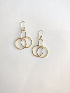 These Handmade Gold Minimal Earrings scream PRETTY all the way! Say more with less is what minimalism is - Get these beautiful Geometric Minimal Dangle & Drop earrings and speak more style and vogue. The earrings can go with everything and you can hop them on in your daily routine. they will work great as office accessories, party earrings as well as gifts :) Specifications: Brass Handmade Gold Plated Minimal earrings Geometric Style Hypoallergenic (suits all skin types) Nickel & Lead-free Metal Hoop Linear Earrings For Pierced Ears, Metal Small Hoop Earrings With Ear Wire, Small Hoop Metal Earrings With Ear Wire, Small Hoop Earrings With Ear Wire In Metal, Everyday Metal Earrings, Nickel-free Hoop Earrings For Everyday, Nickel Free Hoop Earrings For Everyday, Modern Handmade Earrings For Everyday, Modern Everyday Circular Earrings