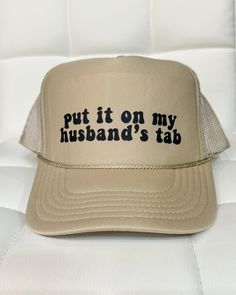 "Put It On My Husband's Tab" design direct-to-film printed on a Tan foam trucker hat with Black writing. The perfect accessory to make a bold statement! One Size Fits Most. All hats are final sale. No returns or exchanges will be allowed on this item. *Please note that our sizes are approximate and there is no guarantee that the item will fit you perfectly. Color and pattern cut may appear slightly different in person and on other devices. Tab Design, Black Writing, Film Prints, Curvy Dress, Sweater Jacket, Final Sale, Trucker Hat, Writing, Film