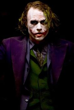 the joker is dressed in a suit and tie