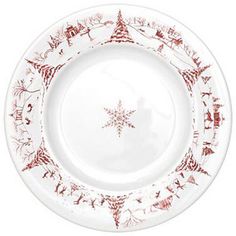 a white plate with red designs on it