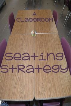 a wooden table with writing on it that says seating strategy in front of purple chairs