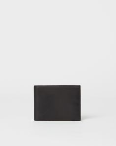 Looks can be deceiving. This sleek Italian leather wallet slips neatly into a pocket and seems too slim to hold much, but is smartly designed to fit all of your cards and cash with ease. Formal Bifold Card Holder With Rfid Blocking, Minimalist Black Business Wallets, Minimalist Black Wallet With Coin Pocket, Formal Black Trifold Wallet With Interior Card Slots, Modern Business Wallet With Id Window, Minimalist Bifold Wallet For Formal Occasions, Modern Wallet With Id Window For Business, Black Trifold Wallet With Card Slots For Formal Use, Elegant Black Trifold Wallet With Smooth Grain