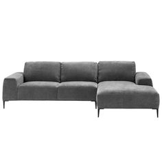 a gray couch sitting on top of a white floor