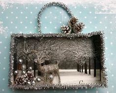 an altered photograph of a deer and pine cones in a snowy scene with polka dots