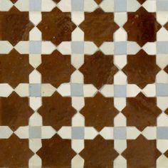 a brown and white tiled floor with small squares