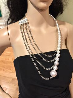 "This unusual, interesting, elegant, feminine, and classy pearl necklace has been designed and made by Mirela Skikic - USA. This complex necklace is made of white glass pearls on silver metal wire that can be adjusted to the position on your chest as you like. It closes with a silver color lobster clasp. It looks very elegant with any type of formal and casual outfit. It also can be a nice wedding accessory. It can be combined with other pieces from my \"Pearl Madness\" collection, which also ca Long Pearl Necklace With Pearl Chain For Party, Long Pearl Necklace For Party, Long Pearl Chain Necklace For Party, Long Pearl Necklace With Pearl Charm For Party, Long Pearl White Pearl Necklace For Party, Elegant Pearl Chain Necklace For Party, Elegant White Beaded Necklace With Chain, Pearl Chain Necklace For Party, Elegant Round Beads Chain Necklace For Parties