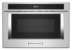 a stainless steel microwave oven with the door open