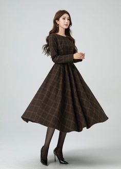 This garment blends timeless elegance with contemporary flair. The cinched waist and flared shape accentuates the waist, and there are pleated details at the waist. The plaid design adds a touch of vintage and sophistication.A must-have for this autumn and winter. DETAIL * 30% wool, 30% fiber, 40% polyester * fully satiny lining, more nice to the touch body * Boat neckline * Long sleeves dress * Two side seam pockets * Back zipper closure * Fit and flare dress * Midi wool dress * Plaid wool dres Warm Winter Dress, Elegant Full Skirt Dress For Fall, Formal Full Skirt Dresses For Fall, Elegant Full Skirt Winter Dress, Chic Fall Midi Dress With Full Skirt, Classic Pleated Midi Dress For Fall, Classic Fit And Flare Fall Dress, Winter A-line Pleated Maxi Dress, Classic Fall Fit And Flare Dresses