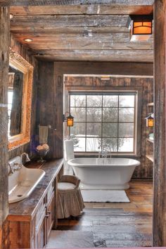 a rustic bathroom with an old fashioned tub and sink in the center, along with wood paneling on the walls