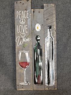 two wine bottles and a glass are painted on wood planks with the words peace love wine