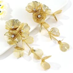 Discover Elegant Style with Every Wear Step into a world of elegance and charm with our Trendy Rhinestone Flower Tassel Earrings. These long drop earrings are designed to make a statement at any gathering, whether it's a festive party or a casual meetup with friends. The glittering rhinestones and delicate flower design add a touch of glamour, perfectly suited for women who love to express their unique style. Product Features Made from high-quality iron alloy, these earrings are both durable and lightweight, ensuring comfort throughout the day. The plant-shaped pendant combined with a sophisticated tassel design offers a trendy and exaggerated appearance that captures attention. Crafted with care, each earring is a testament to fashion-forward thinking and attention to detail. Material: Du Long Tassel Earrings, Long Drop Earrings, Rhinestone Flower, Plant Pattern, Stylish Earring, Hanging Earrings, Delicate Flower, Metal Style, Design Floral