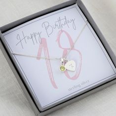 Sterling silver 18th birthday birthstone necklace, makes the perfect gift to mark this special milestone birthday. The necklace is displayed on a pretty 18th birthday presentation card.  It is tucked inside a luxurious Georgia & Grace jewellery box and secured with a hand tied ribbon. If required a handwritten gift card will be tucked under the bow, ready for gifting. Choose either her birthstone or favourite colour from the birthstone chart, this can be purchased with or without a heart initial Silver Birthstone Necklace For May Birthdays, Silver May Birthstone Necklace For Birthday, Silver Birthstone Necklace For Birthday And Mother's Day, Silver Charm Necklace For May Birthstone Birthday Gift, Silver Charm Necklace For May Birthday, Silver Birthstone Necklace For Birthday, Silver Necklace For May Birthstone Birthday, Silver Birthday Necklaces With May Birthstone, Silver Necklace For Birthday With May Birthstone