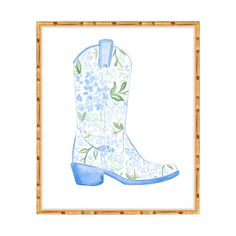 a watercolor painting of a cowboy boot with flowers and leaves on the inside, framed in bamboo