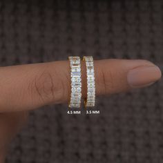 a person's finger with two rings on it