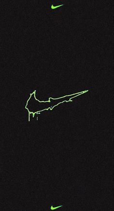 the nike logo glows green in the night sky as it appears to be dripping