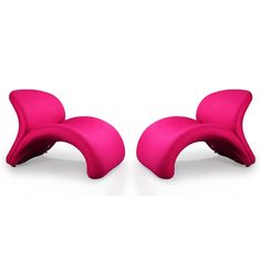 two pink chairs sitting next to each other