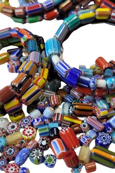 multicolored glass beads are stacked together