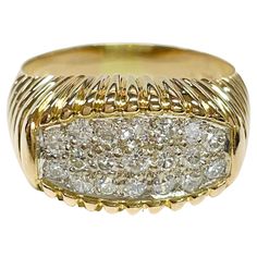 18 Karat Two-Tone White and Yellow Gold Diamond Pavé Ring. The ring features nineteen round pave brilliant-cut diamonds set in white gold. There are seventeen 2.0mm diamonds with a carat weight 0.51ctw, and two 2.5mm diamonds with a carat weight of 0.10ctw. The diamonds have a total carat weight of 0.61ctw. The yellow gold band has ridges along the top and bottom where the diamonds are set in the middle and to about half way of the band. Stamped on the inside of the band is 750 18K. The ring siz Luxury Diamond White Diamond Signet Ring, White Gold Diamond Signet Ring With Round Cut, Luxury Cluster Diamond Ring With Single Cut Diamonds, Luxury Diamond Signet Ring With Round Cut, White Gold Diamond Cut Diamond Signet Ring, White Gold Diamond Cut Signet Ring, Dazzling Diamond Ring With Pave Setting, Luxury Cluster Cut Diamond Ring, Luxury Cluster Diamond Ring