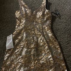 This Is New With Tags. Absolutely Stunning Gold Sequence Blingy Dress Size 4 Champagne Sleeveless Mini Dress For Formal Occasions, Gold Fitted Mini Dress For Prom Season, Gold Fitted Mini Dress For Prom, Gold Mini Dress For Formal Holiday Events, Gold Sleeveless Mini Dress For Homecoming, Formal Gold Mini Dress, Champagne Mini Dress For Evening Holiday, Champagne V-neck Mini Dress For Holidays, Champagne Mini Dress For Formal Occasions