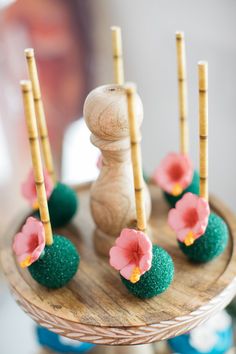 a cake with flowers and candles on it