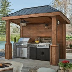 an outdoor kitchen with grill and sink