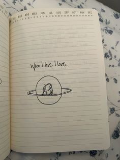 an open notebook with writing on it and a drawing of a dog in the middle