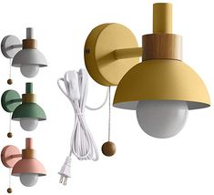 several different colored lights hanging from the side of a light fixture with cords attached to them