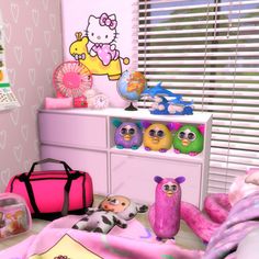 a hello kitty bedroom is shown with toys and decor on the dresser, along with other items