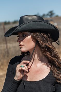 This womens leather cowboy hat is the perfect pairing of form and function. Built using durable, finished, 100% leather, it's built to last and protect you from the sun and rain on any adventure. Yet with its curved brim, and all-leather braided band, it's one of our best-looking hats. Country Style Hat Bands For Festival, Country Style Hat With Leather Sweatband For Country Events, Adjustable Leather Hats For Ranch, Adjustable Leather Hats For Festivals, Wide Brim Leather Hats For Country Events, Black Leather Hat Bands For Rodeo, Adjustable Leather Country Hat Bands, Country Style Hat Bands For Western-themed Events, Leather Hats For Summer Country Events