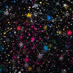 a black background with multicolored stars on it