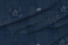 a blue fabric with an intricate design on it