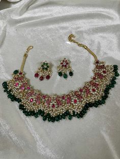 Indian Ethnic Jadau Ahemdabadi Kundan 22 Carat Gold Plated Pink Green Necklace Set * This Set Is made up with High Quality Pachi Kundan * 22 Carat Gold Plating Is used * High Quality Beads Are used * Set includes Necklace, Stud Earrings  * Droppings color can be changed according to your requirement We made Jewelry in pachi kundan /Ahemdabadi kundan and made designs on order only , need at least 25 days to make ,to do customization as they are acceptable. jewellery details :All jewellery are made with silver base and luxury gold plated next to real, generally we work on direct made on order.   We are  the dealers of Authentic and traditional Indian Jewelry  We  are honored to present you our elegant, stylish and unique designs with a  wide range of items in different Indian Jewelry categor Kundan Chandbali Necklaces For Celebrations, Celebration Kundan Chandbali Necklace, Chandbali Kundan Necklaces For Celebrations, Eid Round Kundan Temple Necklace, Temple Jewelry Necklaces For Eid, Festive Kundan Necklace With Hand-set Details, Festive Kundan Tilla Necklaces, Festive Heavy Kundan Pearl Necklace, Heavy Chandbali Pearl Necklace For Festive Occasions