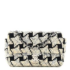 This is an authentic CHANEL Tweed Quilted Mini Rectangular Flap in Black, Ecru blue, and White. This small crossbody shoulder bag is crafted of black and white tweed.The bag features a silver chain link shoulder strap threaded with black leather and a frontal flap with a silver Chanel CC turn lock. This opens to a compact black leather interior with zipper and patch pockets. Classic Rectangular Tweed Shoulder Bag, Designer Black Tweed Bag, Designer Tweed Top Handle Bag, Black Rectangular Tweed Shoulder Bag, Rectangular Black Tweed Shoulder Bag, Designer Tweed Shoulder Bag Rectangular, Designer Tweed Bags In Rectangular Shape, Designer Tweed Rectangular Bag, Designer Tweed Rectangular Shoulder Bag