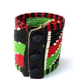 Zulu Bead, Kenya Jewelry, Masai Bracelet, Africa Bracelet, Bead Cuff Bracelet, Statement Bracelet, Masai Jewelry, Africa Jewelry, Wrap Bracelet. FREE SHIPPING FOR ALL ADDITIONAL JEWELRY IN YOUR CART You will receive it Exactly as pictured in the Kenyan colors. USA #1. Order Total of $35 eligible for $0 shipping #2. Order Total of $60 eligible for Free Expedited shipping via DHL Express. EUROPE #1. Order Total of $60 eligible for Free Expedited shipping via DHL Express.. Still shopping? Checkout Bohemian Cuff Bracelet With Large Beads, Bohemian Adjustable Cuff Bracelet With Large Beads, Adjustable Bohemian Cuff Bracelet With Large Beads, Adjustable Bangle With Round Beads For Festivals, Traditional Adjustable Bangle With Colorful Beads, Unique Cuff Bracelet With Round Beads For Festivals, Traditional Adjustable Stretch Bracelet, Traditional Woven Bangle Bracelet, Traditional Green Adjustable Cuff Bracelet