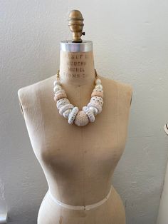 Gorgeous for spring and summer in our classic white. Wooden rings and ball beads wrapped in light cream and white ribbon trim, lace and rickrack. Thanks for looking! White Beach Necklaces For Spring, Spring Beach White Necklace, White Beach Necklace For Spring, White Beaded Jewelry For Spring, Spring White Beaded Jewelry, Handmade White Necklaces For Spring, White Vintage Summer Jewelry, Vintage White Summer Jewelry, Handmade Feminine White Necklace