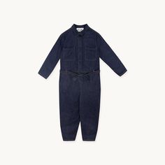 Kick off the winter season in style with this classic Denim Jumpsuit. This heavy denim jumpsuit in deep indigo features twin pockets on the chest, side pockets and back pockets and a waist tie. Style it layered over a tee with TTBS socks and your favourite trainers for the perfect autumnal look.  Made in Portugal.Measurements for size 36:Top length: 48,5cm. 
Pant length: 91cm. 
Chest width: 50cm. 
Waist width: 47cm. Dark Wash Utility Denim Jumpsuit, Utility Style Dark Wash Denim Jumpsuit, Utility Denim Blue Jumpsuit With Side Pockets, Utility Style Belted Jumpsuit For Fall, Casual Denim Jumpsuit With Belt Loops For Work, Utility Style Denim Jumpsuit With Pockets, Utility Denim Overall Jumpsuit With Pockets, Denim Utility Jumpsuit With Pockets, Utility Dark Wash Denim Jumpsuit With Pockets