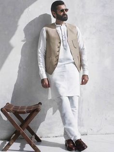 Tailored Sleeveless Suit For Wedding, Tailored White Vest For Semi-formal Occasions, Tailored Sleeveless Wedding Suits, Sleeveless Vest With Buttons For Wedding, Elegant Wedding Vest With Buttons, Sleeveless White Nehru Jacket For Wedding, Fitted Vest With Buttons For Wedding, Tailored Sleeveless Three-piece Suit For Wedding, Fitted Wedding Vest With Buttons