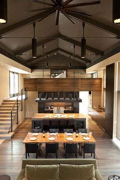 an instagramted photo of a dining room and kitchen with stairs in the background