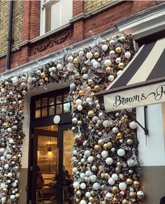 a store front with christmas decorations on it